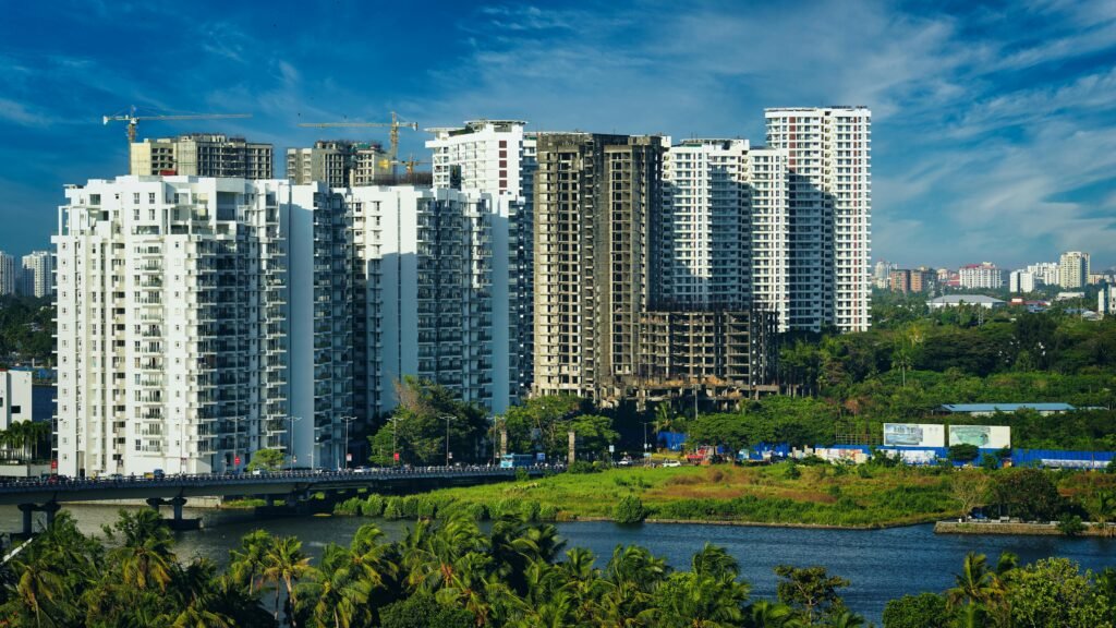 Stunning cityscape of Kochi's modern skyline with high-rise apartments and lush greenery.